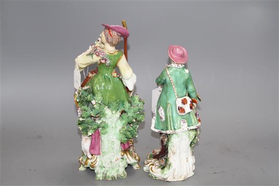 Two Chelsea gold anchor figures of a shepherdess and a huntsman, c.1765, 27.5 and 22.5cm